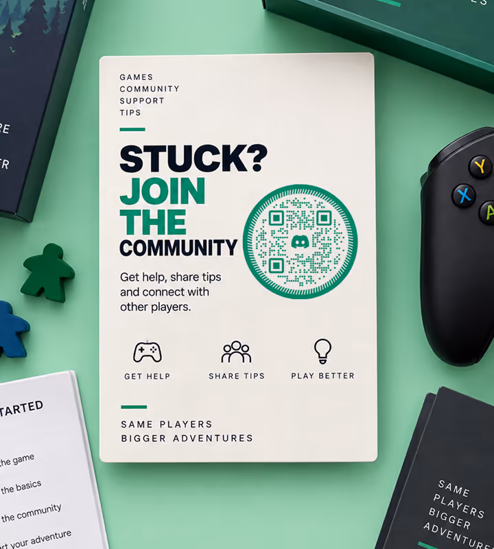 A cream “Stuck? Join the community” card with a green circular QR code, resting in a board-game box beside a controller and wooden playing pieces