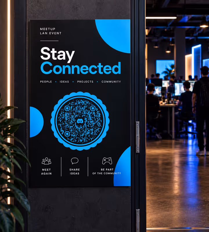 A black “Stay Connected” sign for a meetup and LAN event with a blue scalloped round QR code, on the wall beside the door to a hall of gamers at their screens