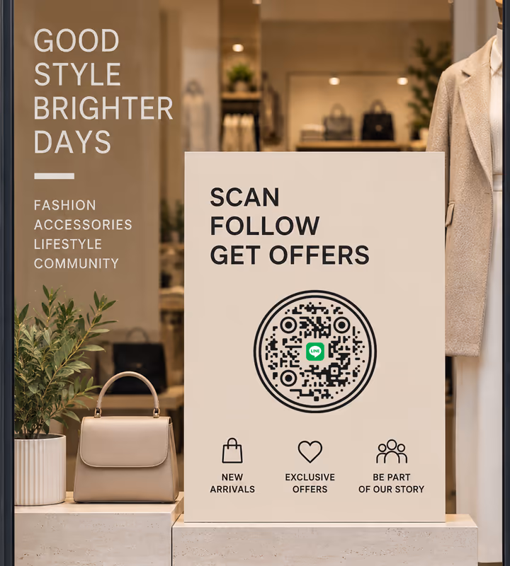 A cream “Scan, follow, get offers” sign with a black circular QR code, in a fashion shop window beside a handbag on a plinth