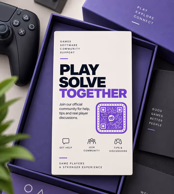 A cream “Play, solve, together” insert card with a purple rounded QR code, lying in a game box beside a controller
