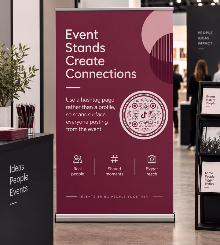 A burgundy roll-up banner headed “Event stands create connections” with a circular QR code, at an exhibition with visitors in the background