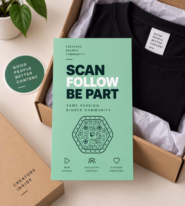 A mint green “Scan, follow, be part” insert card with a hexagonal QR code, lying in a kraft box with a folded black T-shirt