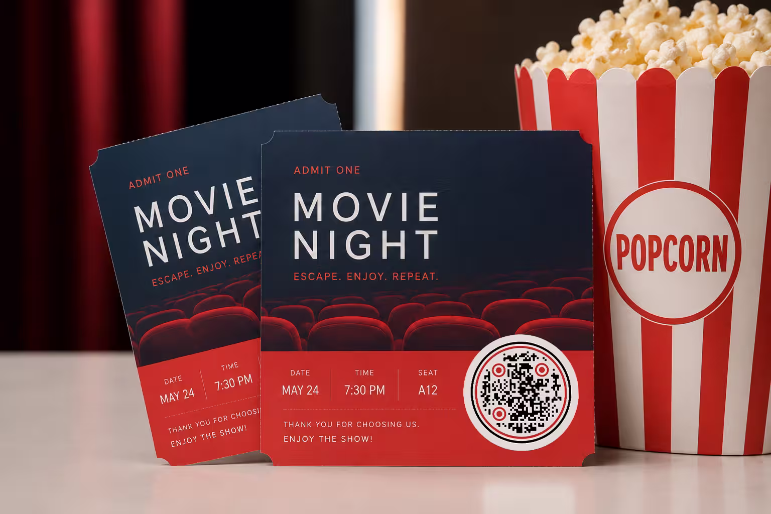 บัตรเข้างาน "Movie Night" สองใบ พร้อม QR Code ทรงกลมข้างรายละเอียดที่นั่ง อยู่ข้างกล่องป๊อปคอร์นลายทาง