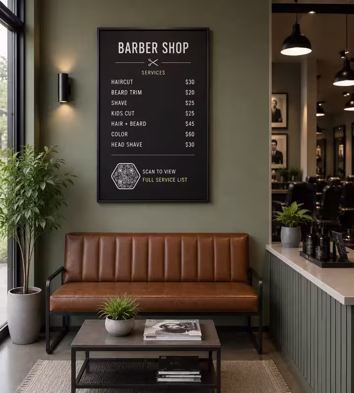 A framed barbershop price board above a leather waiting bench, with a hexagonal QR code reading “Scan to view full service list”