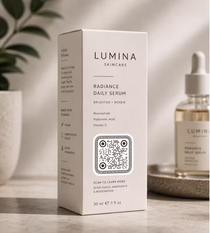 A skincare serum box with a QR code on the front, standing beside a dropper bottle
