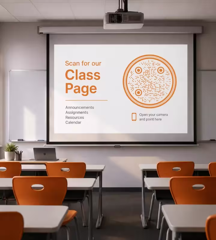 कक्षा में प्रोजेक्टर की स्क्रीन, जिस पर “Scan for our class page”, गोल नारंगी QR कोड और “Open your camera and point here” लिखा है