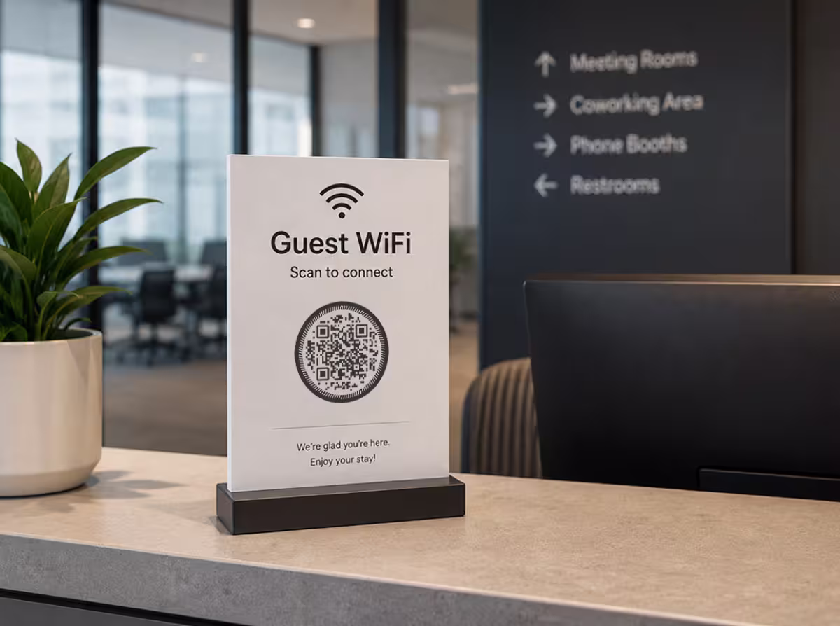 A round circular-framed QR code on a “Guest WiFi” sign