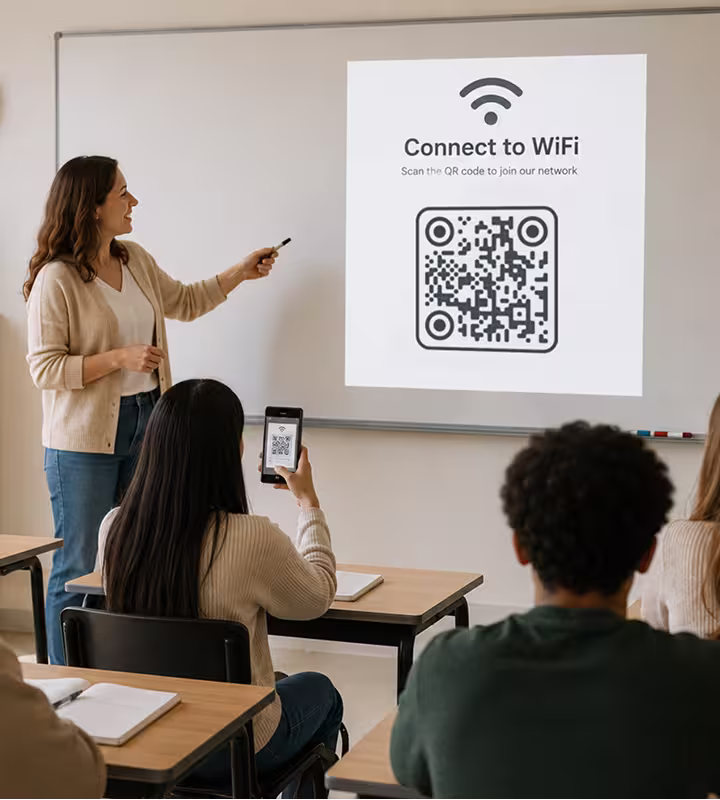 A person in a meeting room holding up their phone to scan a “Connect to WiFi” QR code projected on the whiteboard